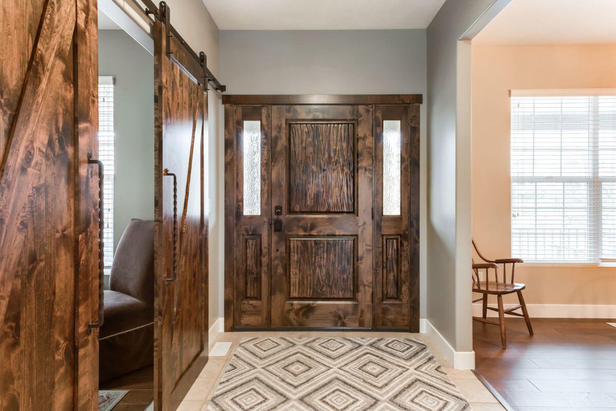 Entry way with patterned tile and sliding barn doors